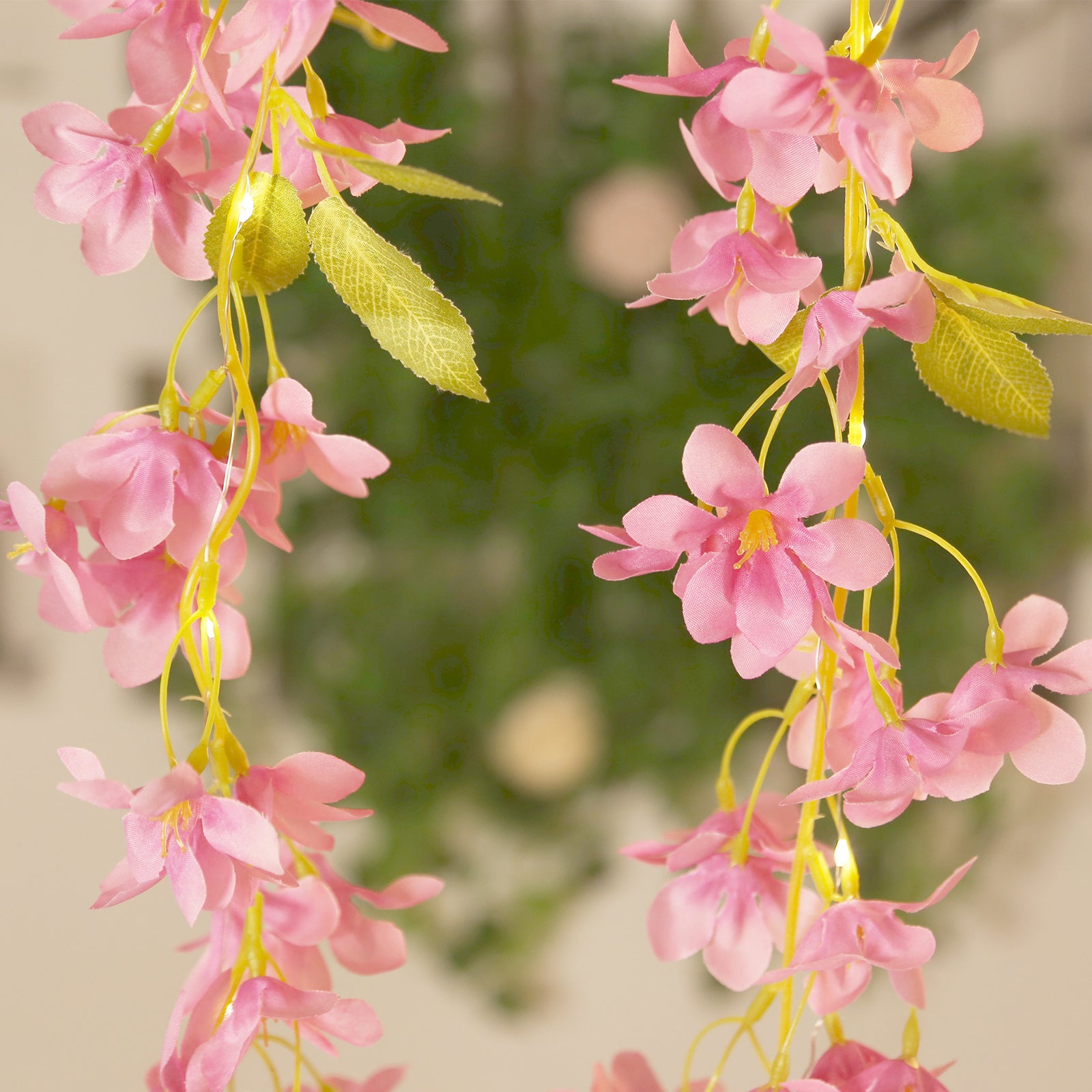 Pink jasmine flower garland with warm white LED lights, 6ft long.
