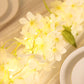 White jasmine flower garland with warm white LED lights.