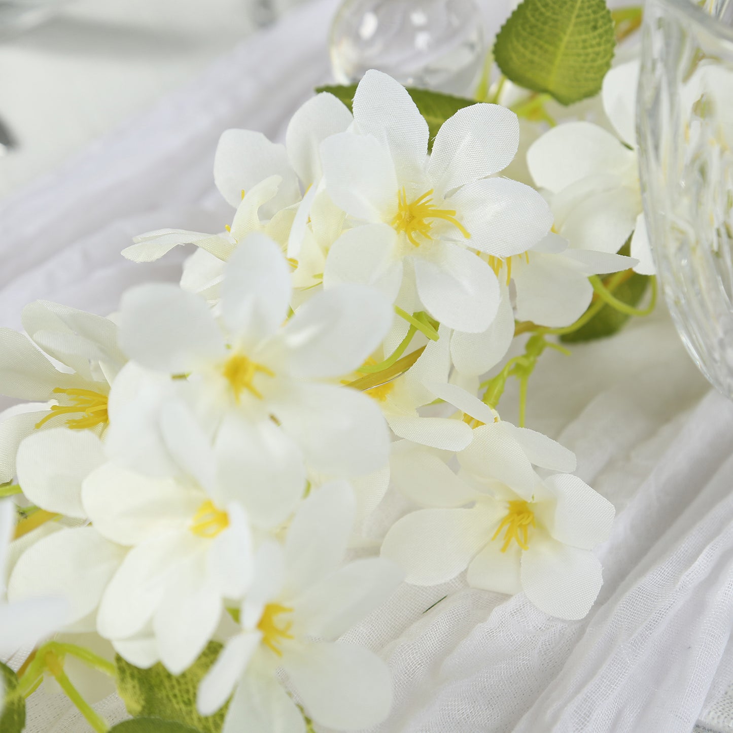 White jasmine silk flower garland with warm white fairy lights.