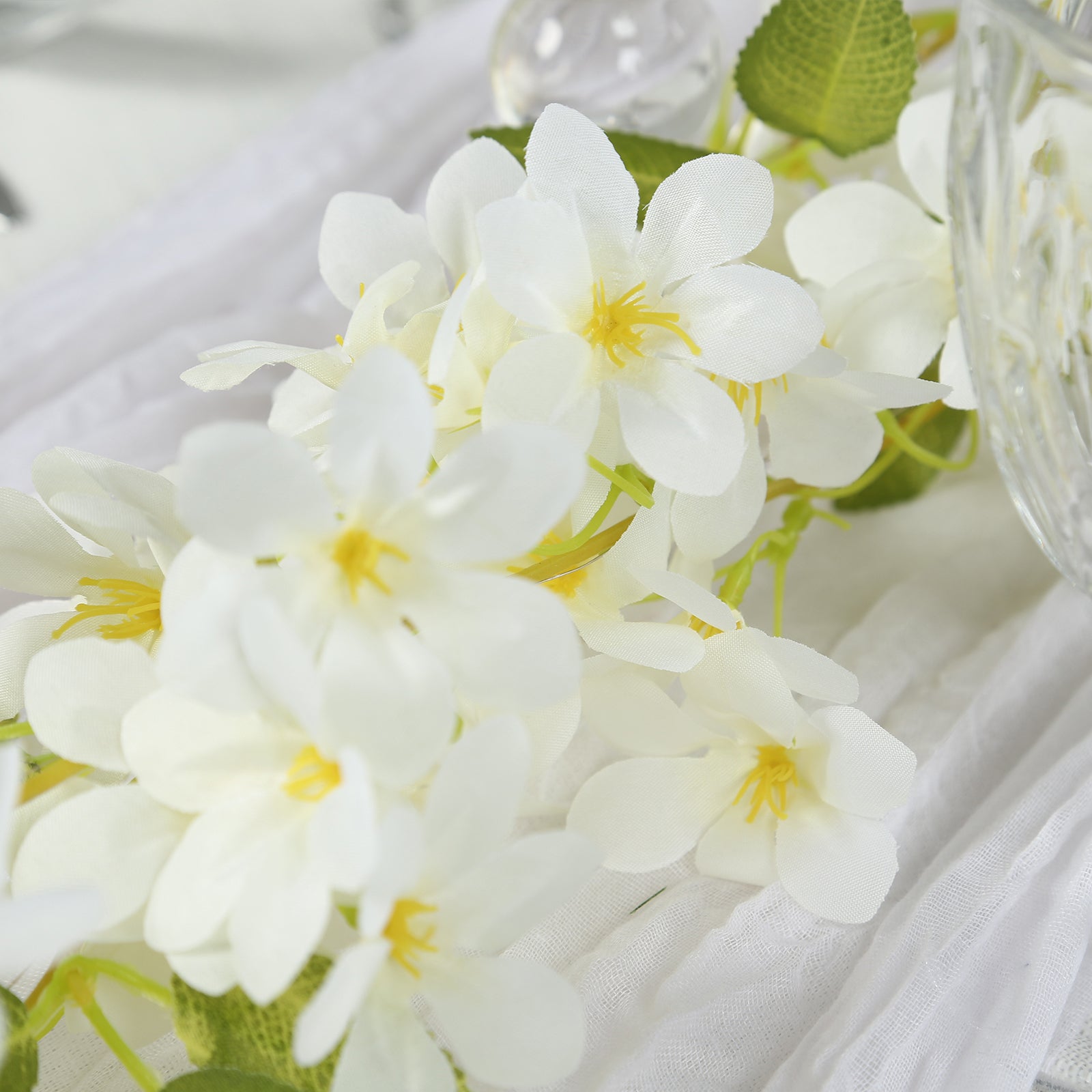 White jasmine silk flower garland with warm white fairy lights.