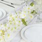 White jasmine silk flower garland with warm white LED lights.