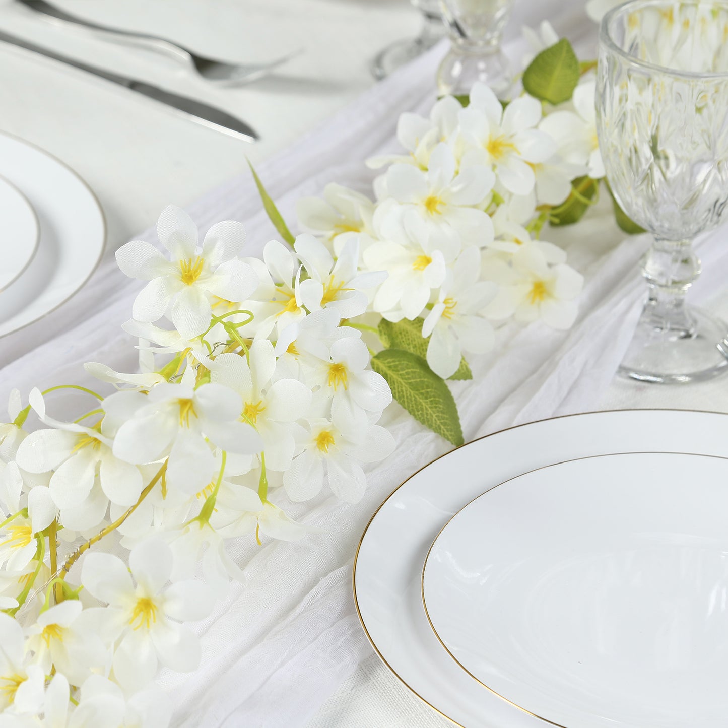 White jasmine silk flower garland with warm white LED lights.