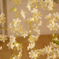 White jasmine silk flower garland with warm white LED fairy lights.