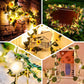 Warm white LED sunflower garland string lights on greenery backdrop.