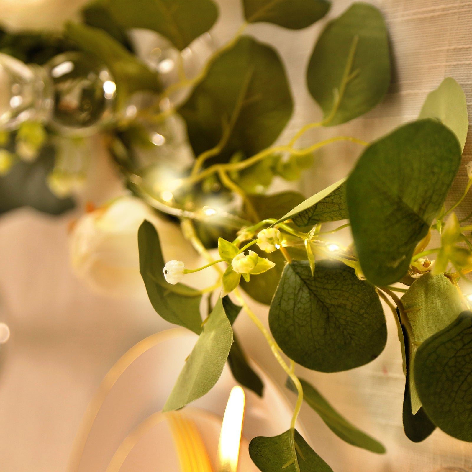 Lighted greenery garland with eucalyptus & peonies in vibrant green.