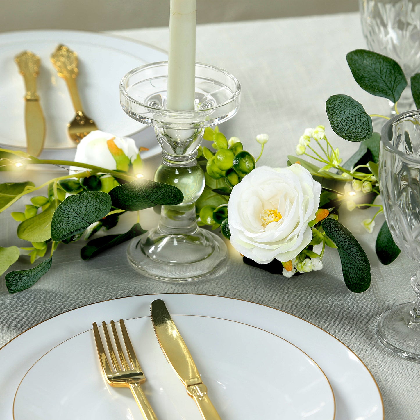 Lighted greenery garland with eucalyptus and peonies for table styling.