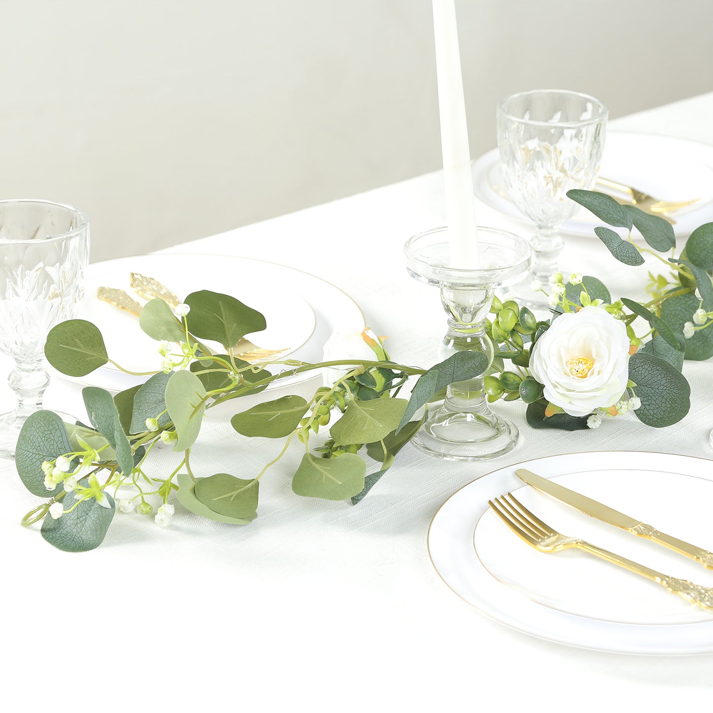 Lighted greenery garland with eucalyptus and peonies in soft green.