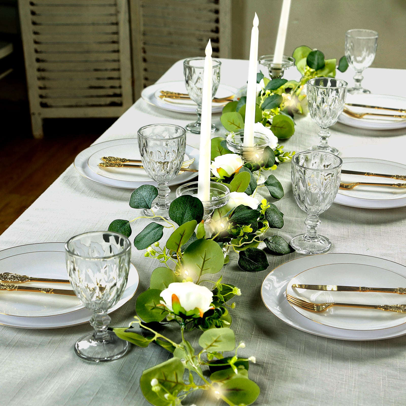 Lighted greenery garland with eucalyptus and peonies for table styling.