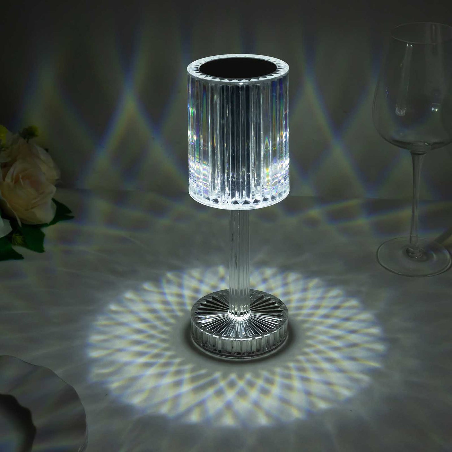 Color-changing LED crystal cylinder table lamp with a white glow.