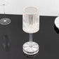 Color changing LED crystal cylinder table lamp with a sleek acrylic design.