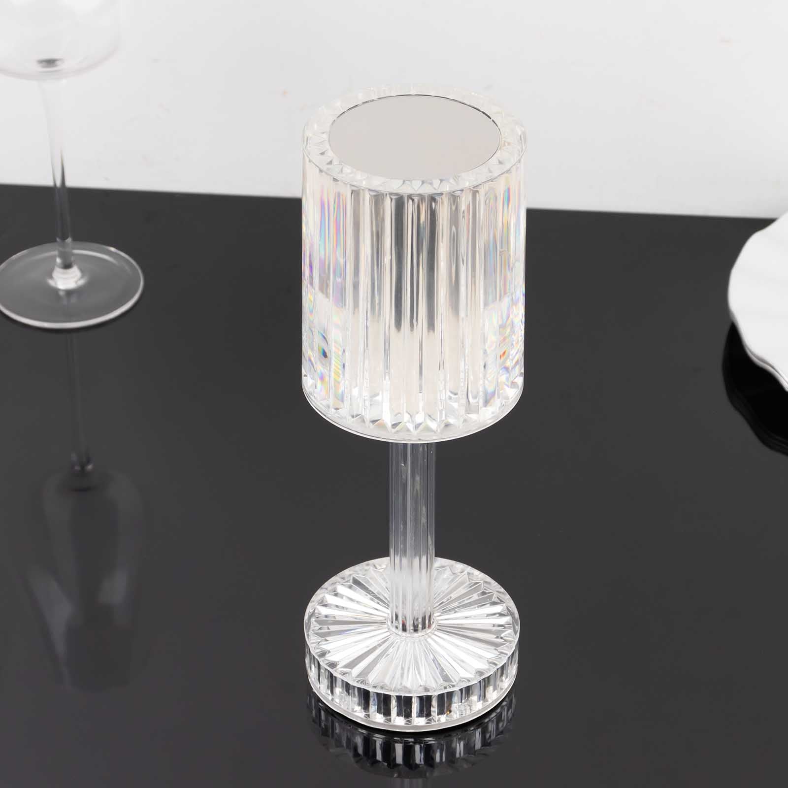 Color changing LED crystal cylinder table lamp with a sleek acrylic design.