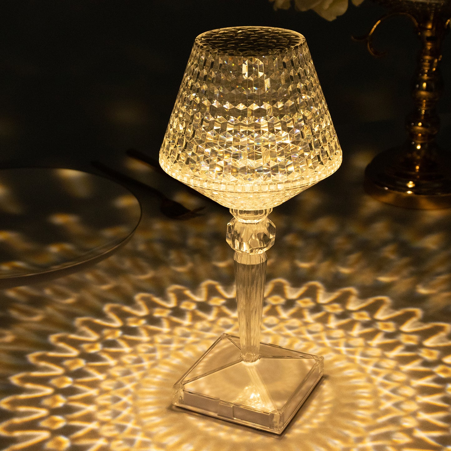 Color changing acrylic crystal table lamp with warm light effects.