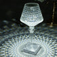 Color changing crystal table lamp with intricate design and soft lighting.