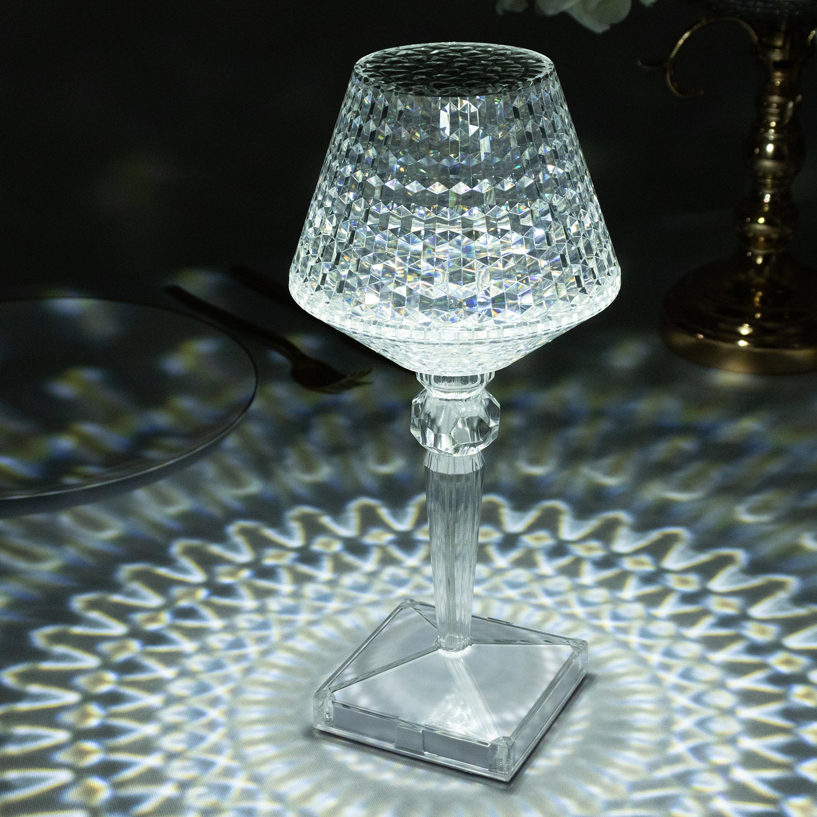 Color changing crystal table lamp with intricate design and soft lighting.