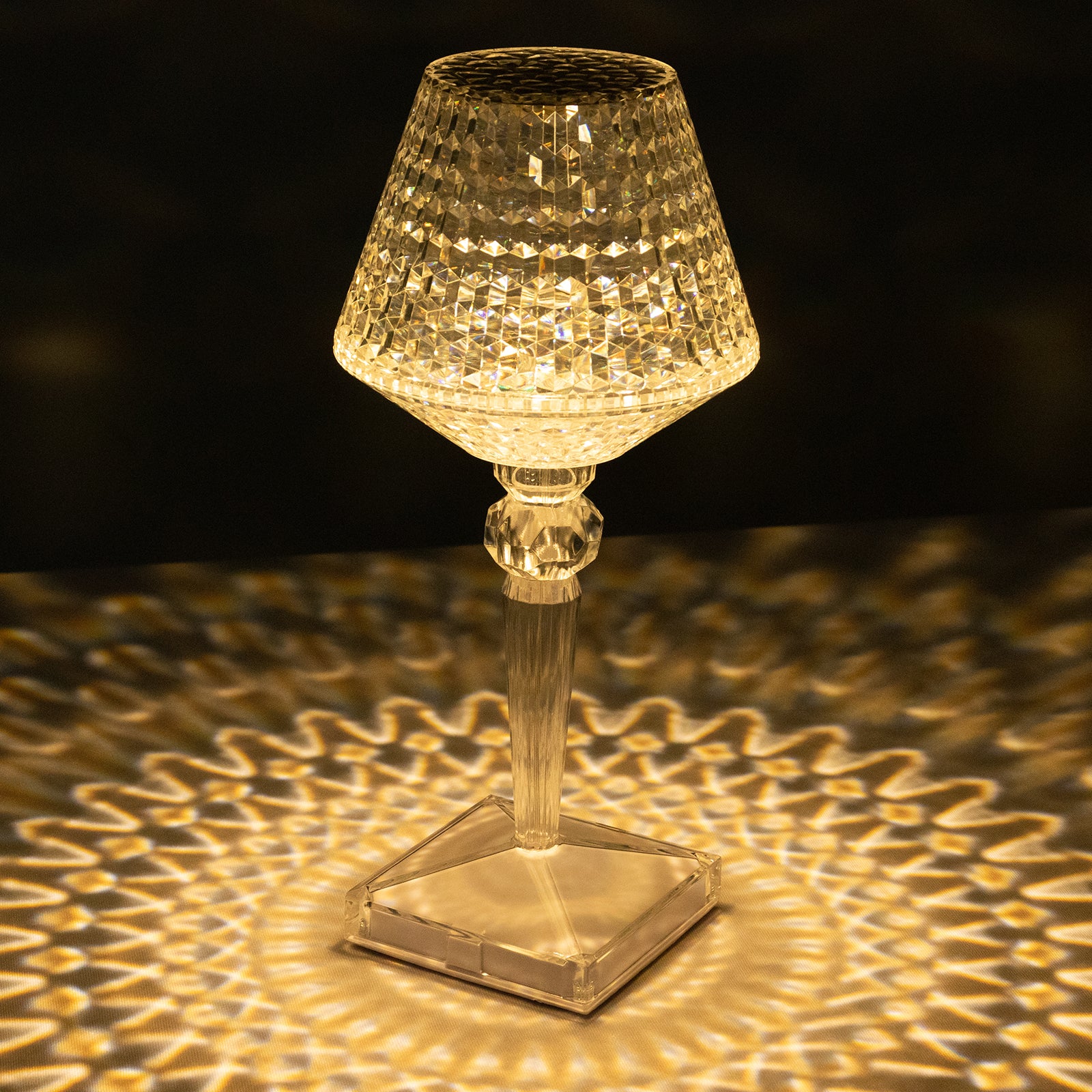 Color changing LED acrylic crystal lamp with touch control, emitting warm light.