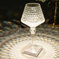 Color changing LED crystal cup shape table lamp with a sparkling clear design.