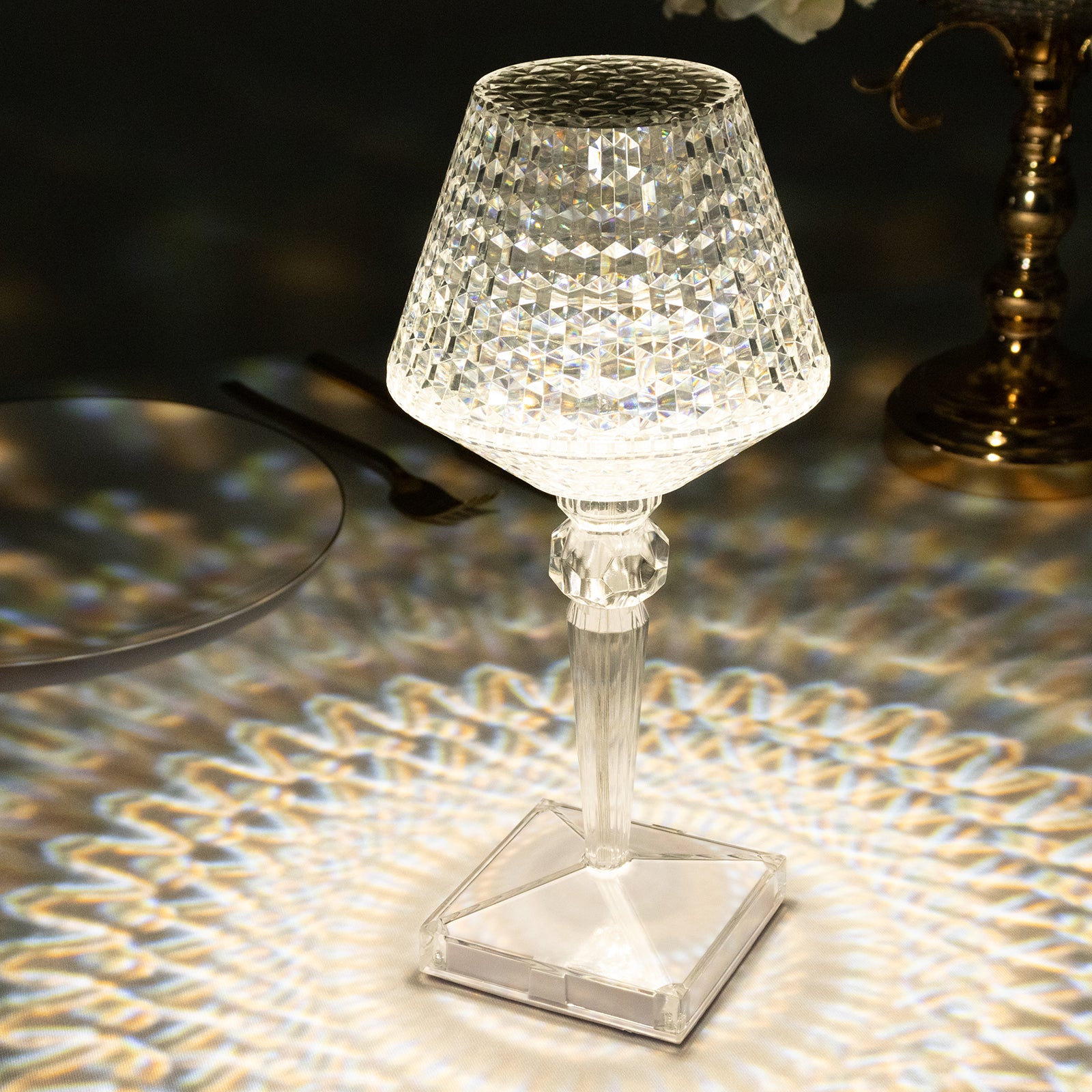 Color changing LED crystal cup shape table lamp with a sparkling clear design.