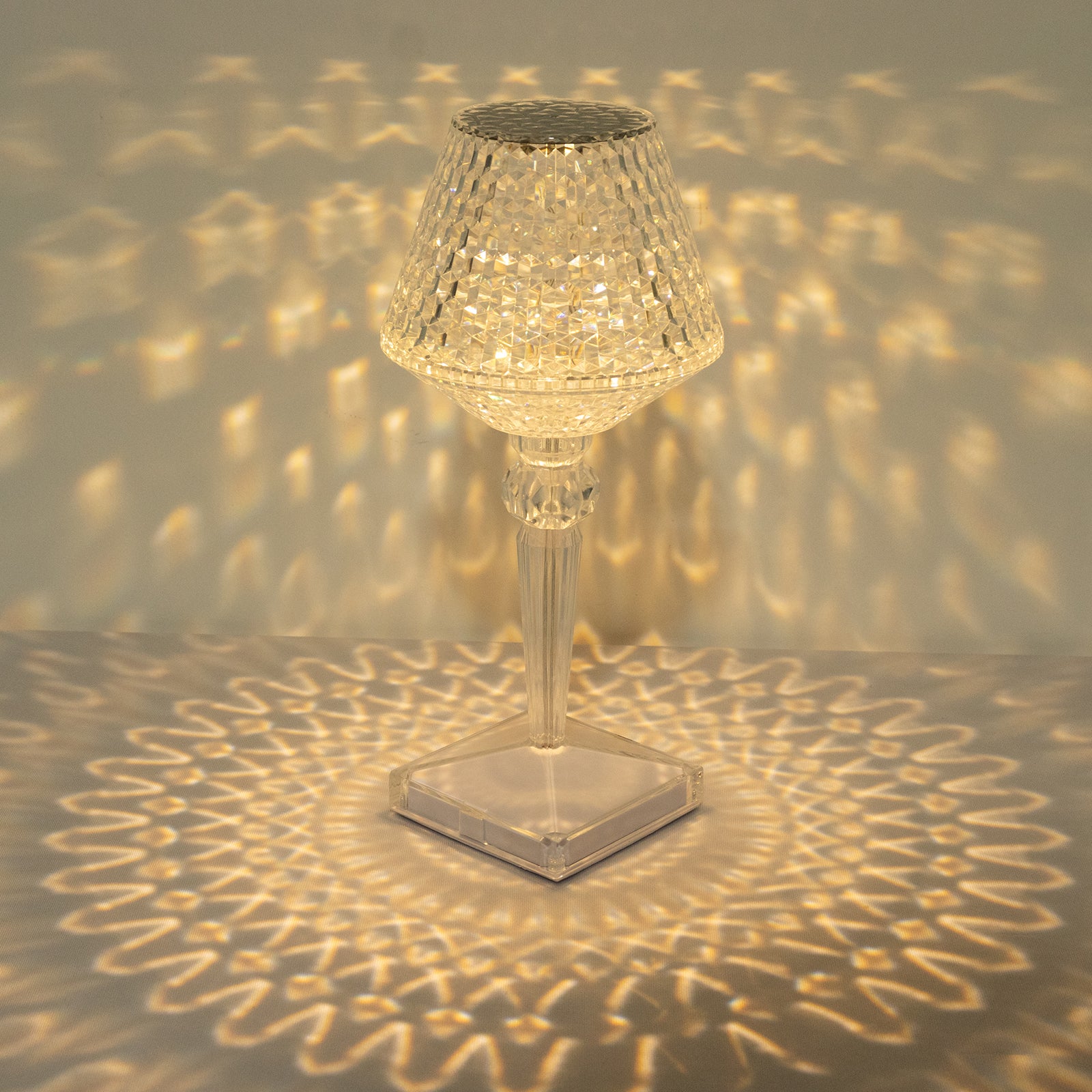 Clear LED acrylic crystal cup shape color changing lamp with warm light.