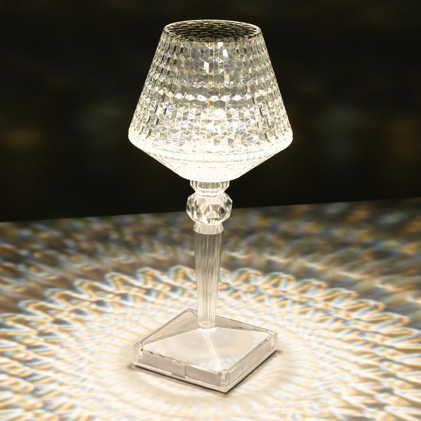 Color changing acrylic crystal table lamp with a sparkling design.