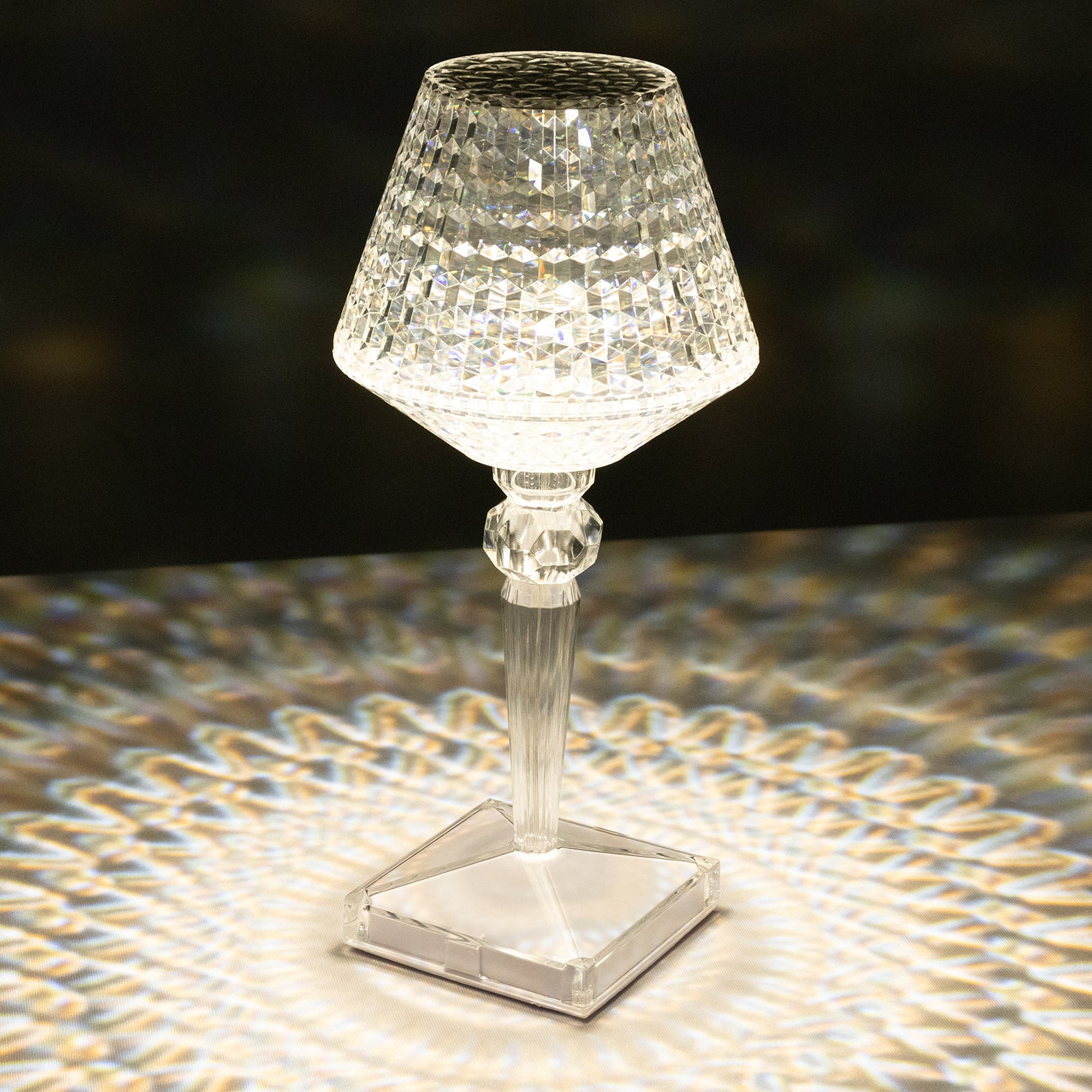Color changing acrylic crystal table lamp with a sparkling design.
