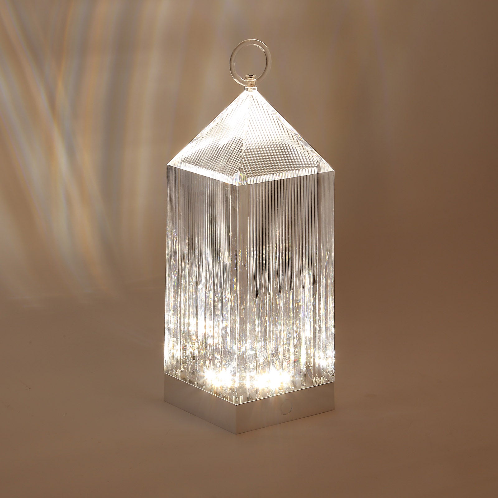 Clear LED crystal lantern table lamp with rechargeable touch control.