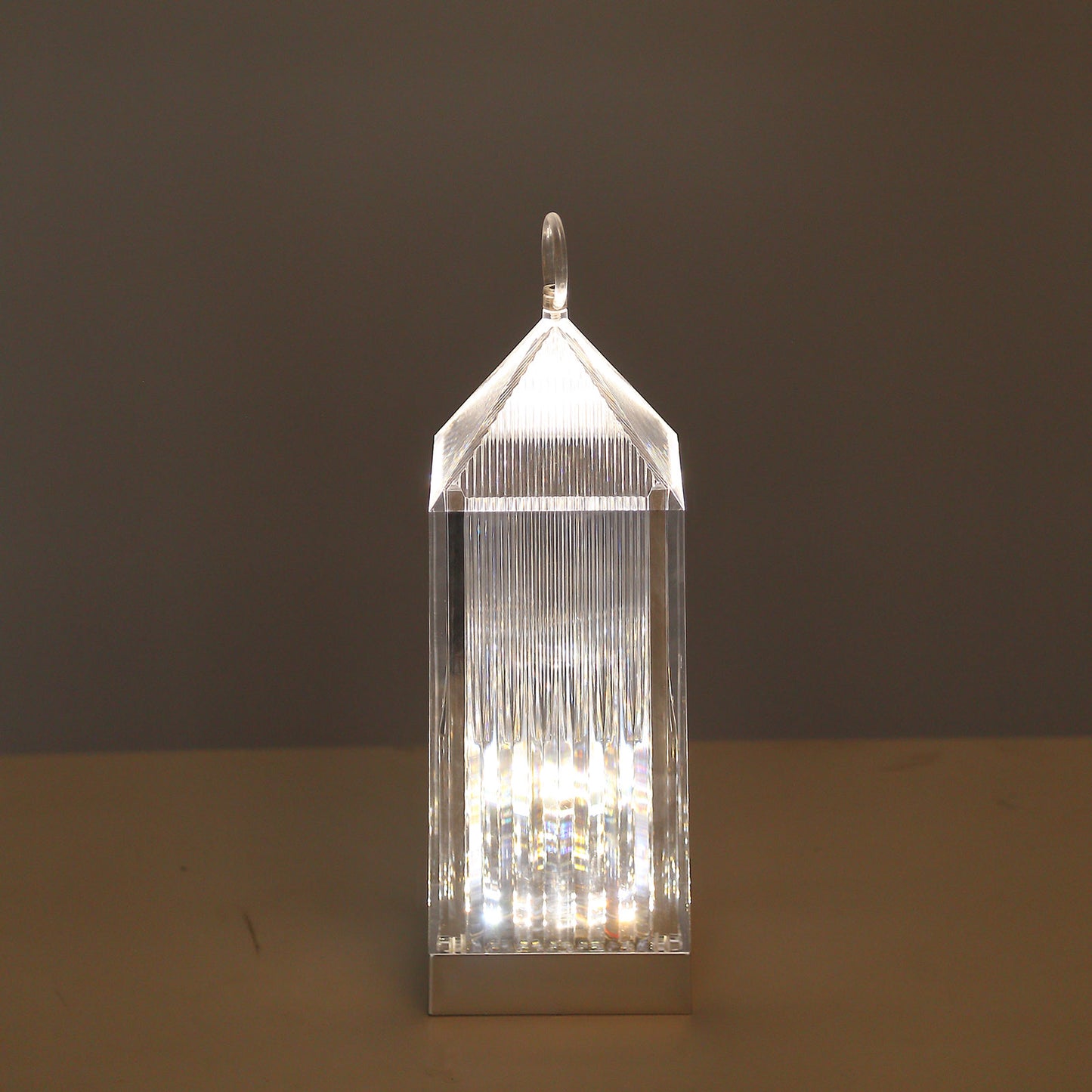 Clear LED crystal lantern table lamp with touch control.