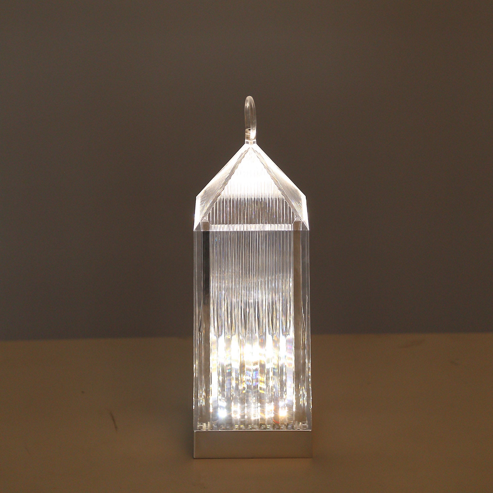 Clear LED crystal lantern table lamp with touch control.