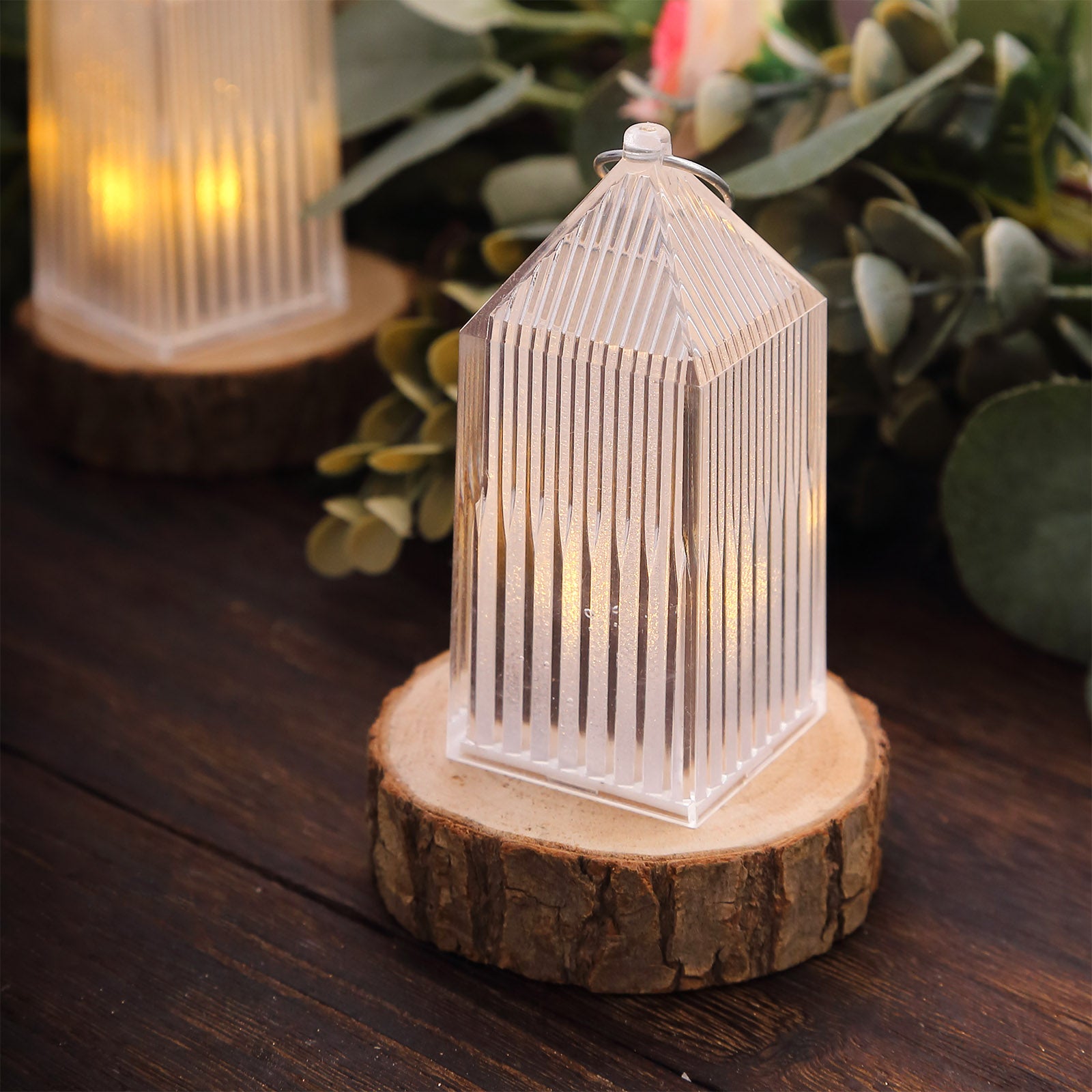 Clear warm white mini lantern lamp on a wooden base, decorative LED centerpiece.
