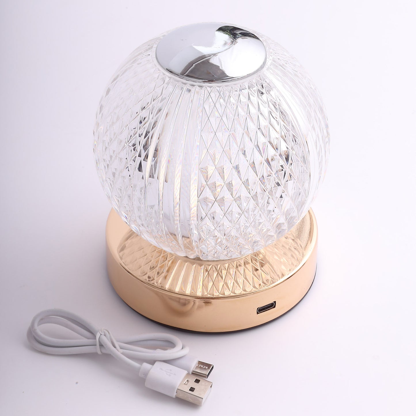 Dimmable LED crystal ball lamp with gold base and touch control.