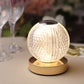 Dimmable LED crystal ball lamp with touch control and gold base.