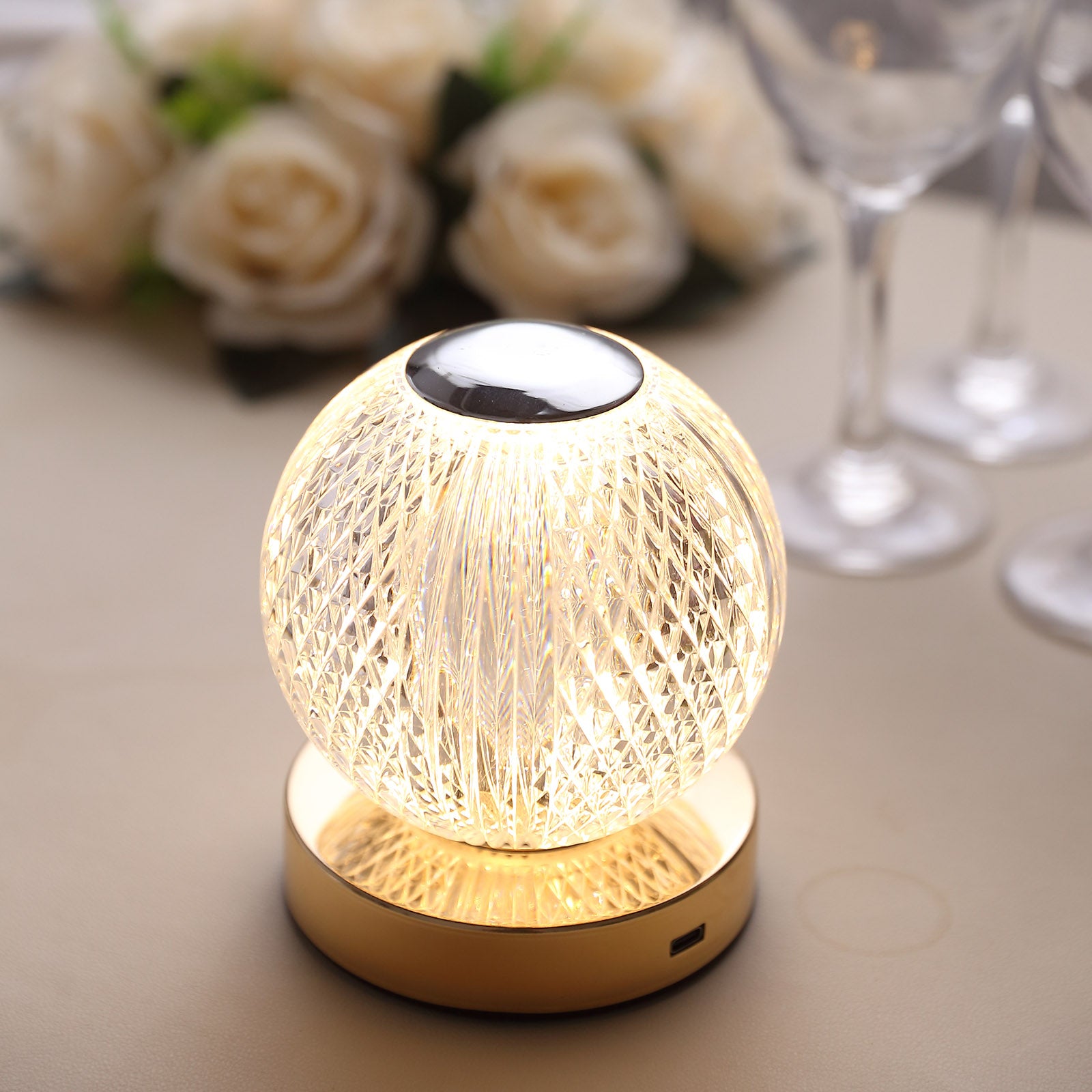 Dimmable LED crystal ball lamp with warm white light and touch control.