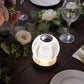 Dimmable LED crystal ball lamp with touch control, glowing warm white light.