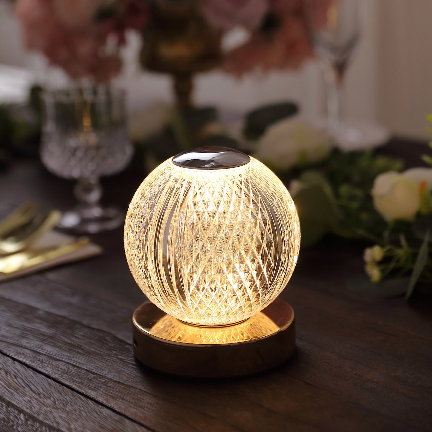 Dimmable LED centerpiece lamp with a warm white glow and diamond cut design.