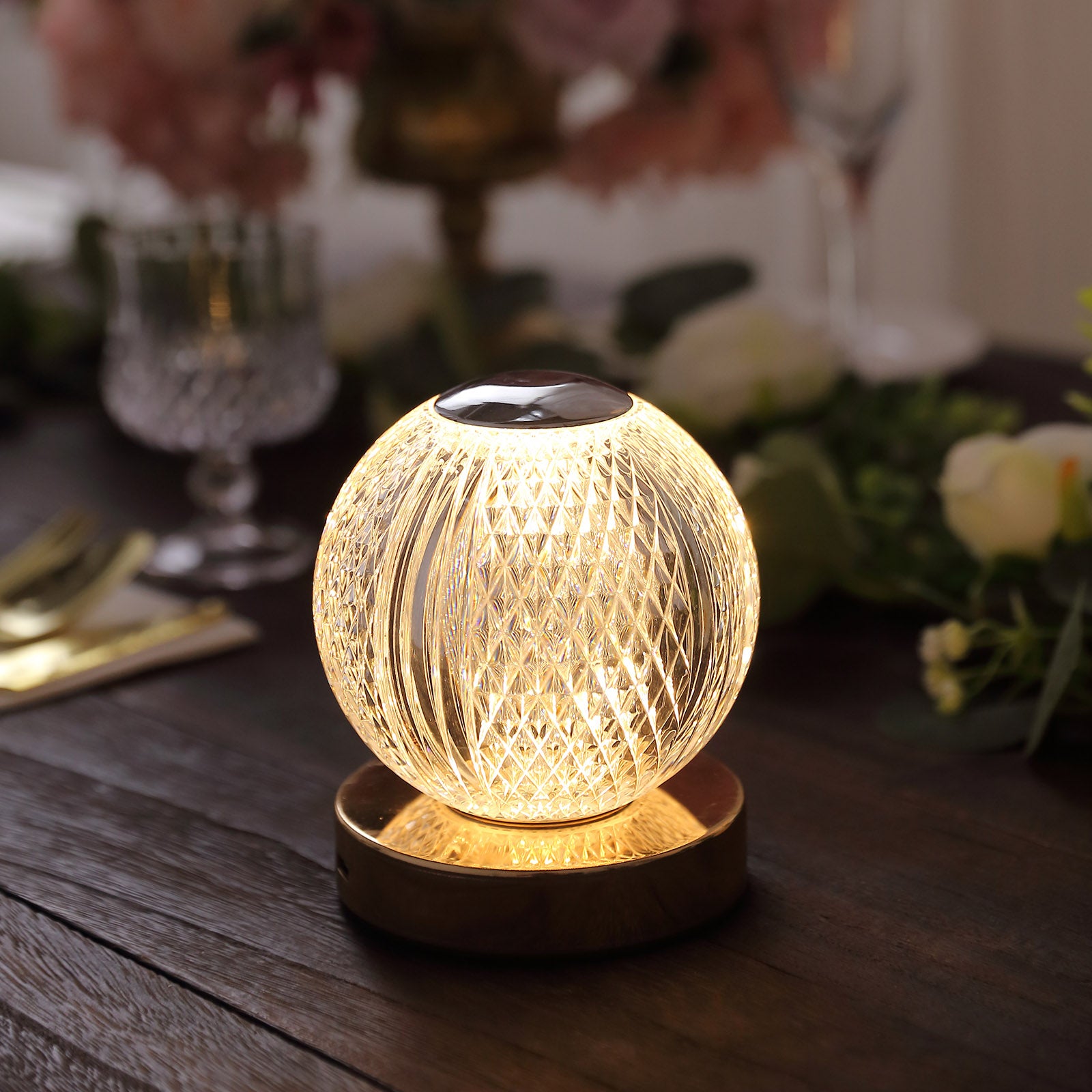 Dimmable LED centerpiece lamp with a warm white glow and diamond cut design.