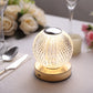 Dimmable LED crystal ball lamp with touch control, warm white glow.