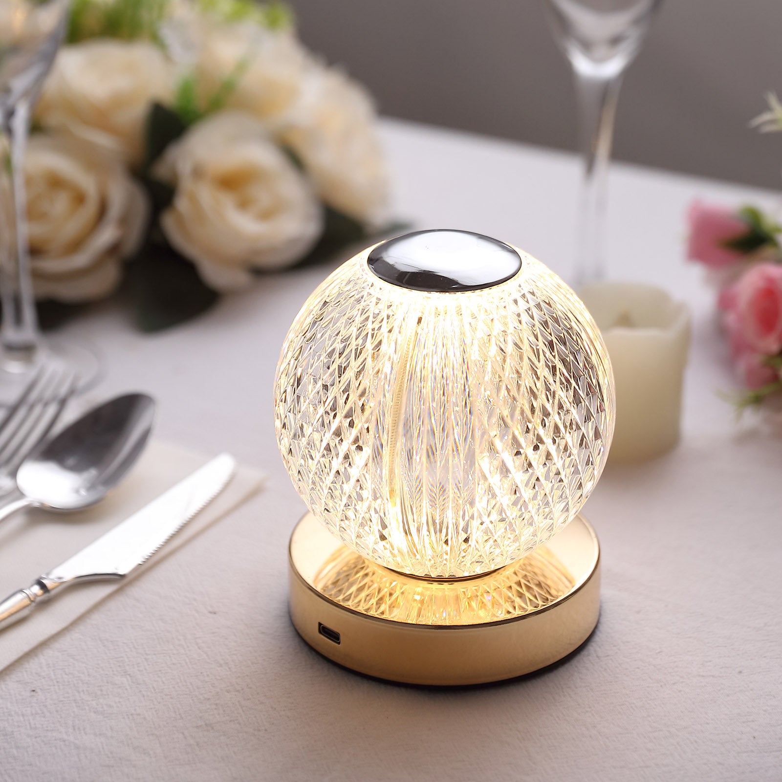 Dimmable LED crystal ball lamp with touch control, warm white glow.