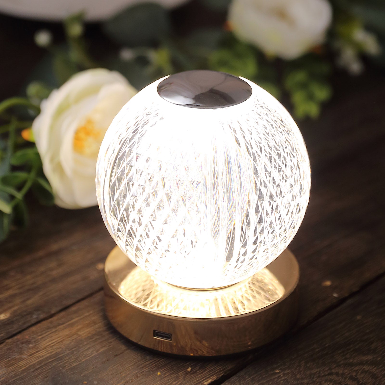 Dimmable LED centerpiece lamp with diamond cut design in clear and gold.