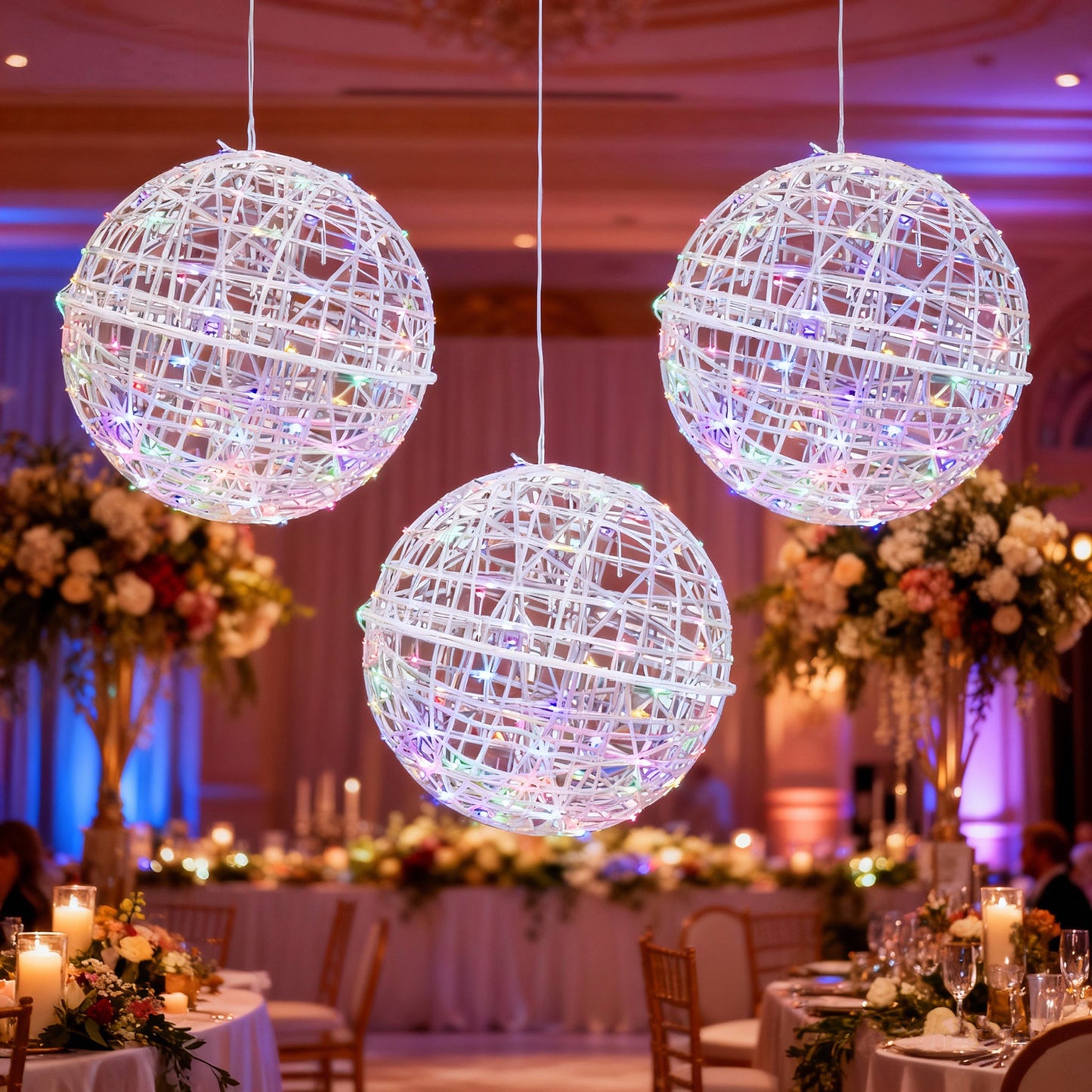 White LED lighted decorative sphere balls hanging in a festive setting.