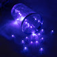 Purple mini LED lights scattered around a clear container.