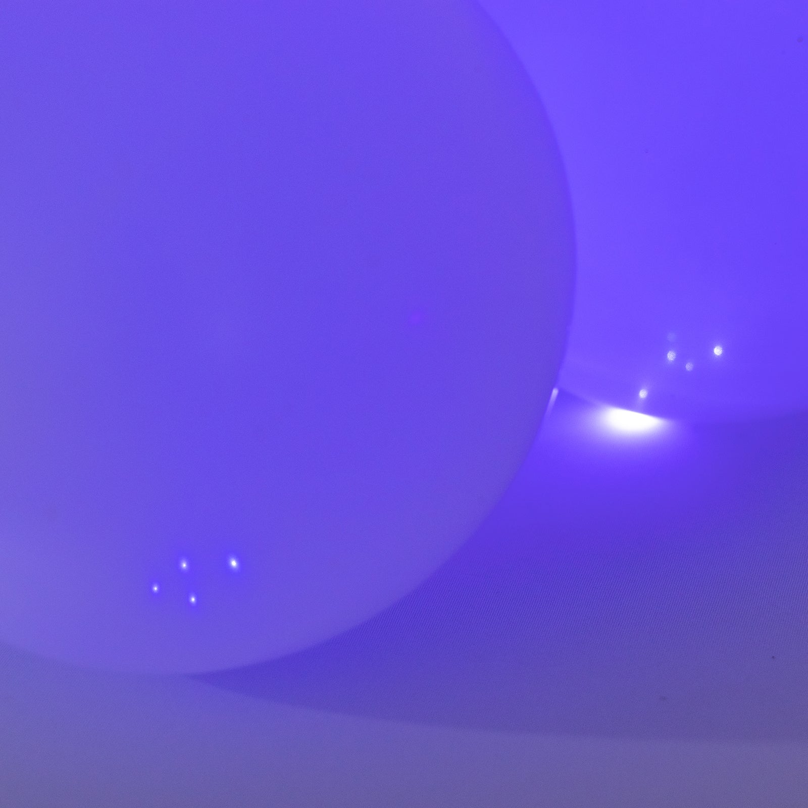 Purple mini LED balls, waterproof, battery-operated, 0.5" diameter.