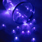 Purple mini LED balls, battery-operated and waterproof, scattered on a surface.