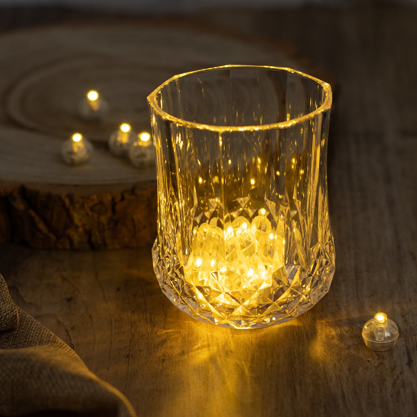 Warm white mini LED ball lights in a crystal holder, creating a cozy ambiance.