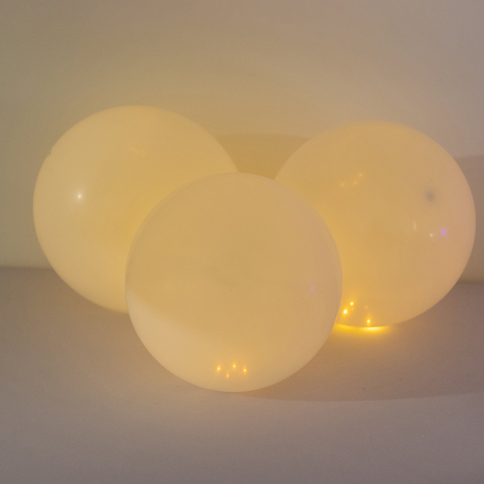 Warm white mini LED balloon lights, waterproof, battery-operated, 0.5 inches.
