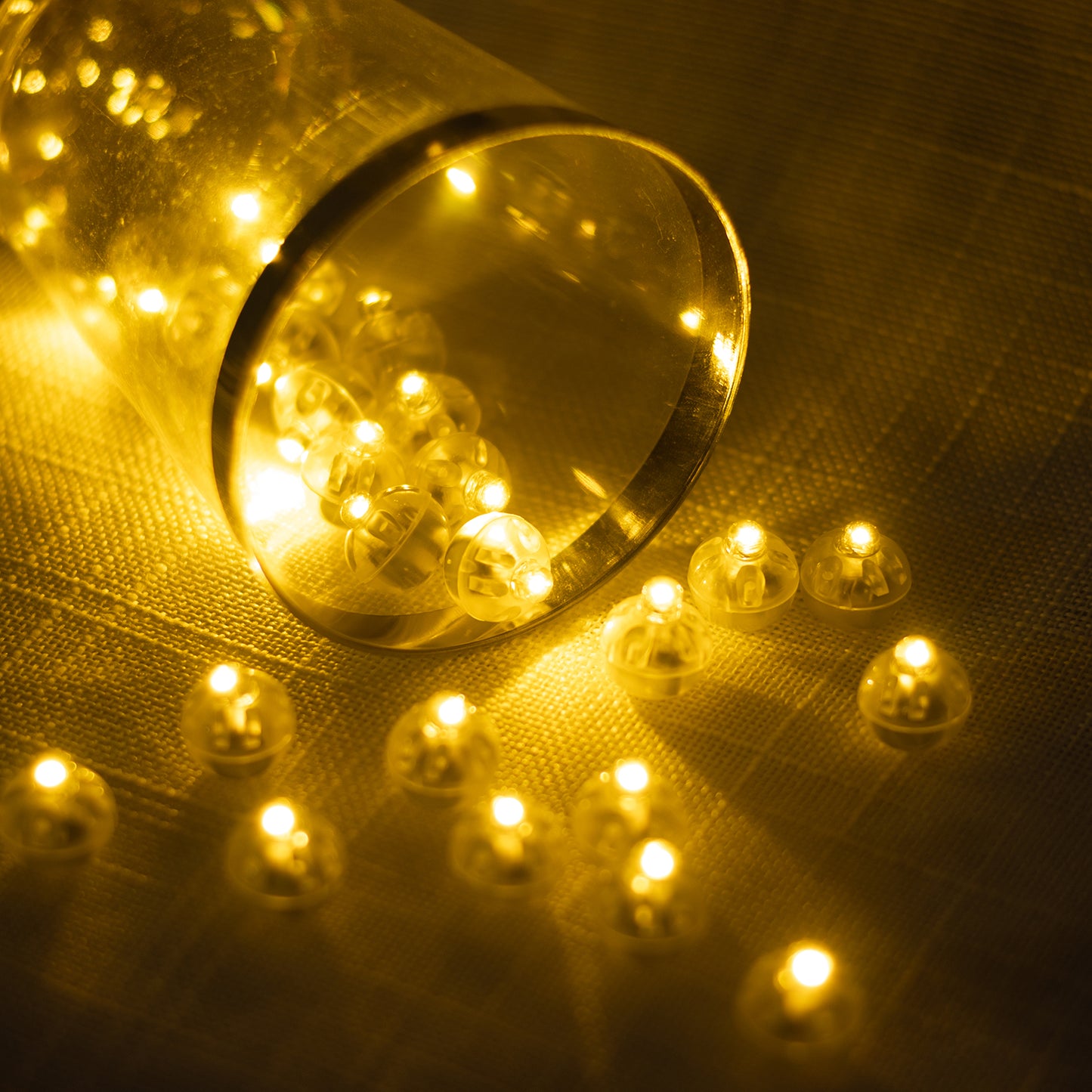 Warm white mini LED ball lights, waterproof and battery operated, 0.5" size.