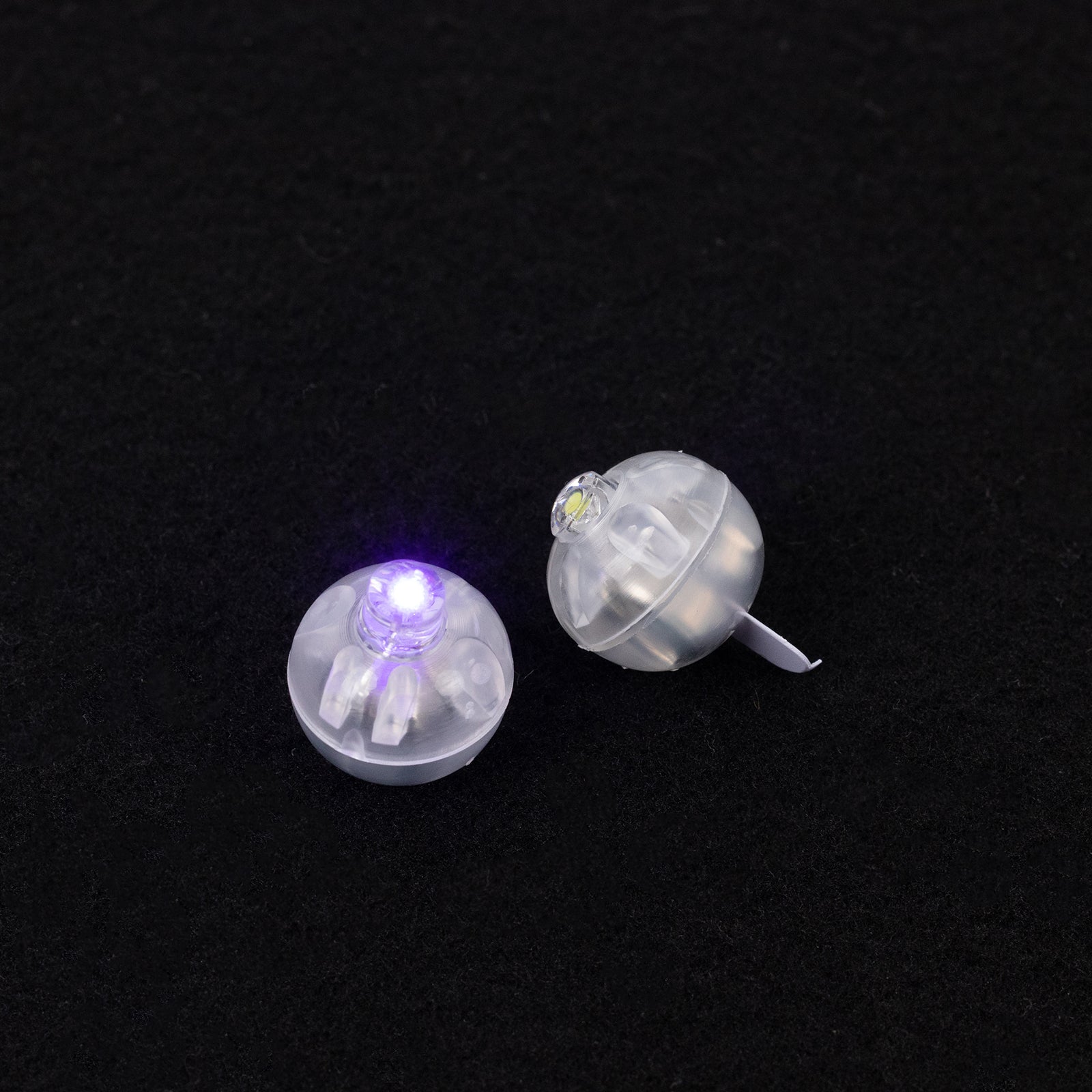 Purple mini LED balls, waterproof balloon lights, battery operated.