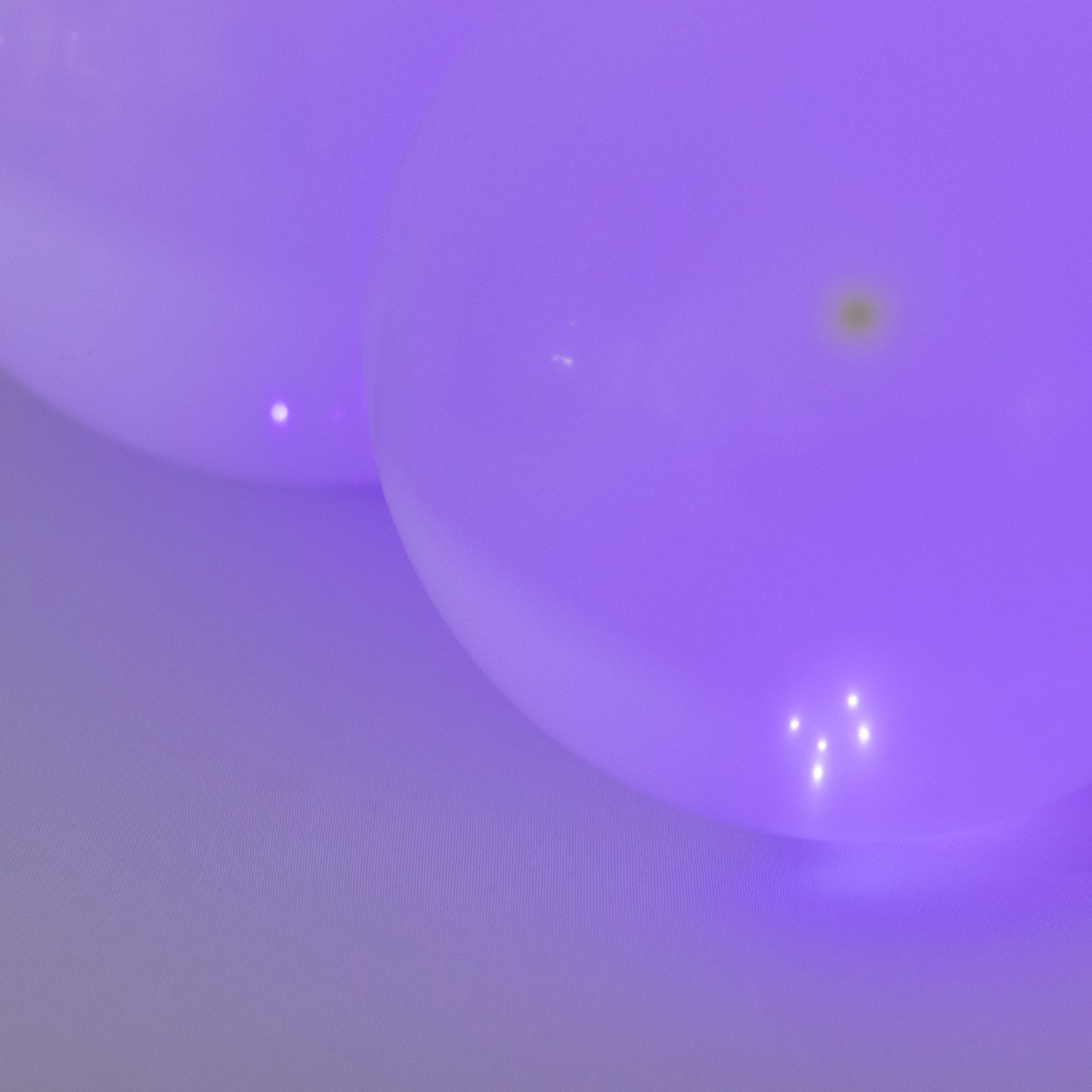 Purple round mini LED balls, waterproof, battery-operated lights.