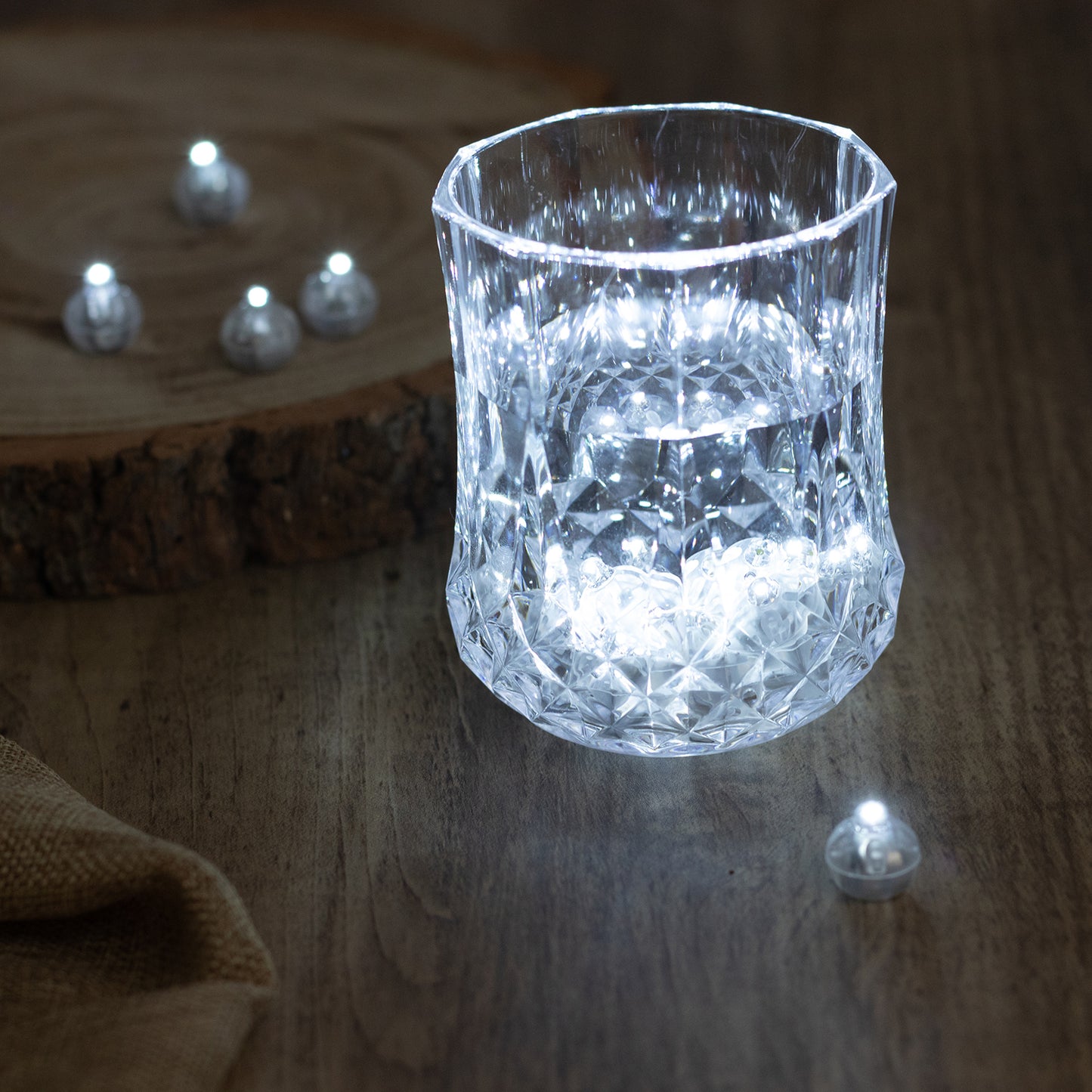 White round mini LED balls in a decorative glass, providing soft illumination.