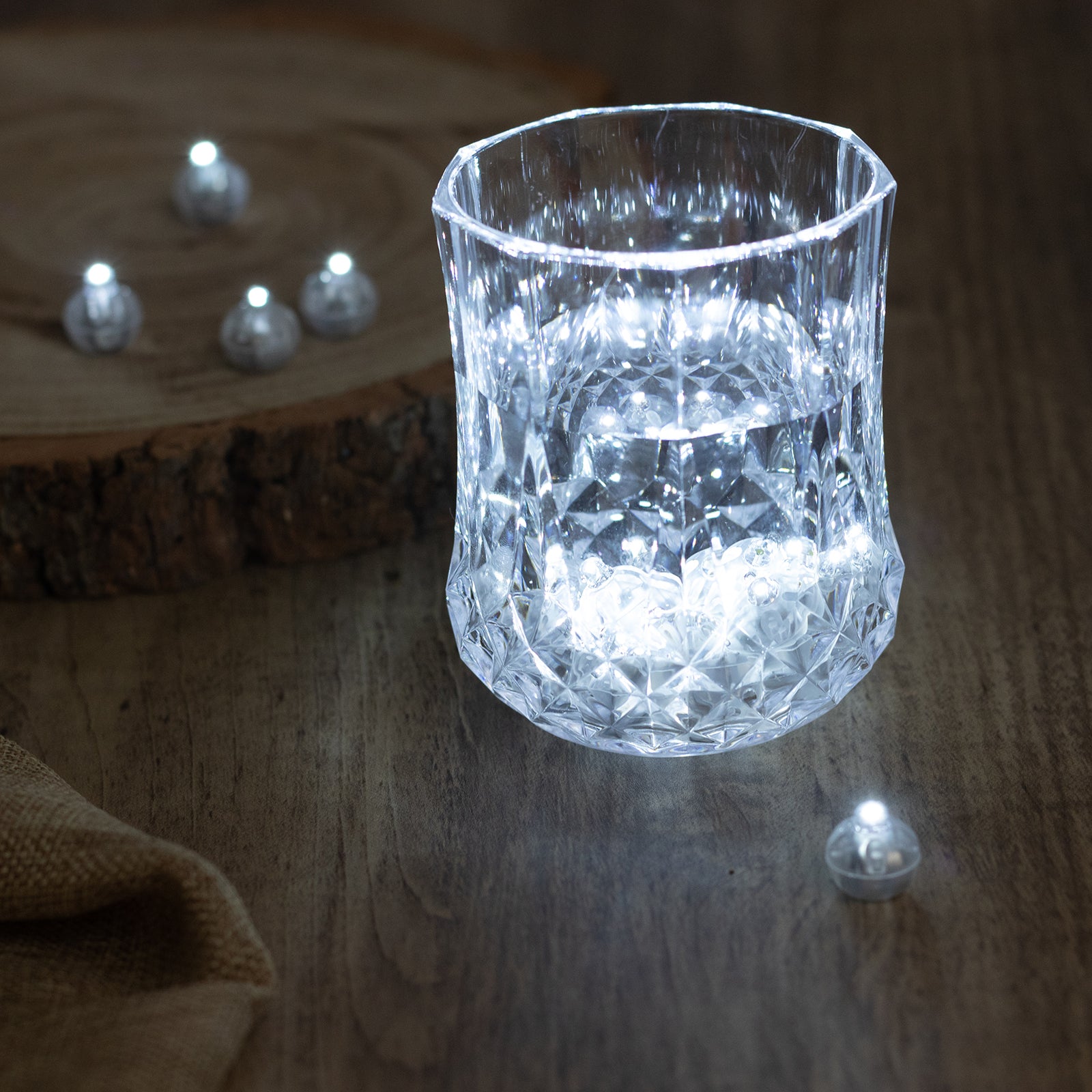 White round mini LED balls in a decorative glass, providing soft illumination.