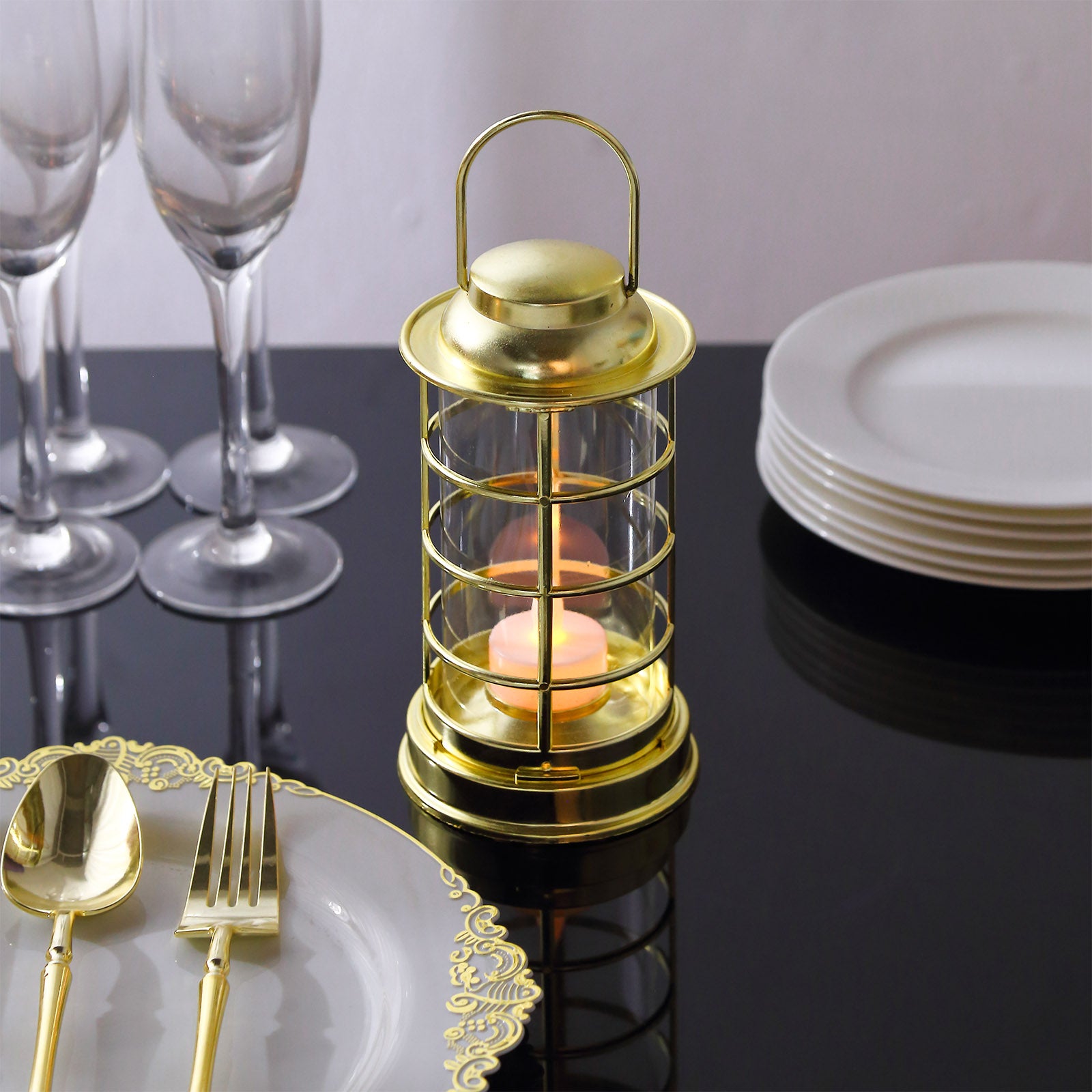 Gold LED mini lantern lamp on a dining table with elegant tableware.