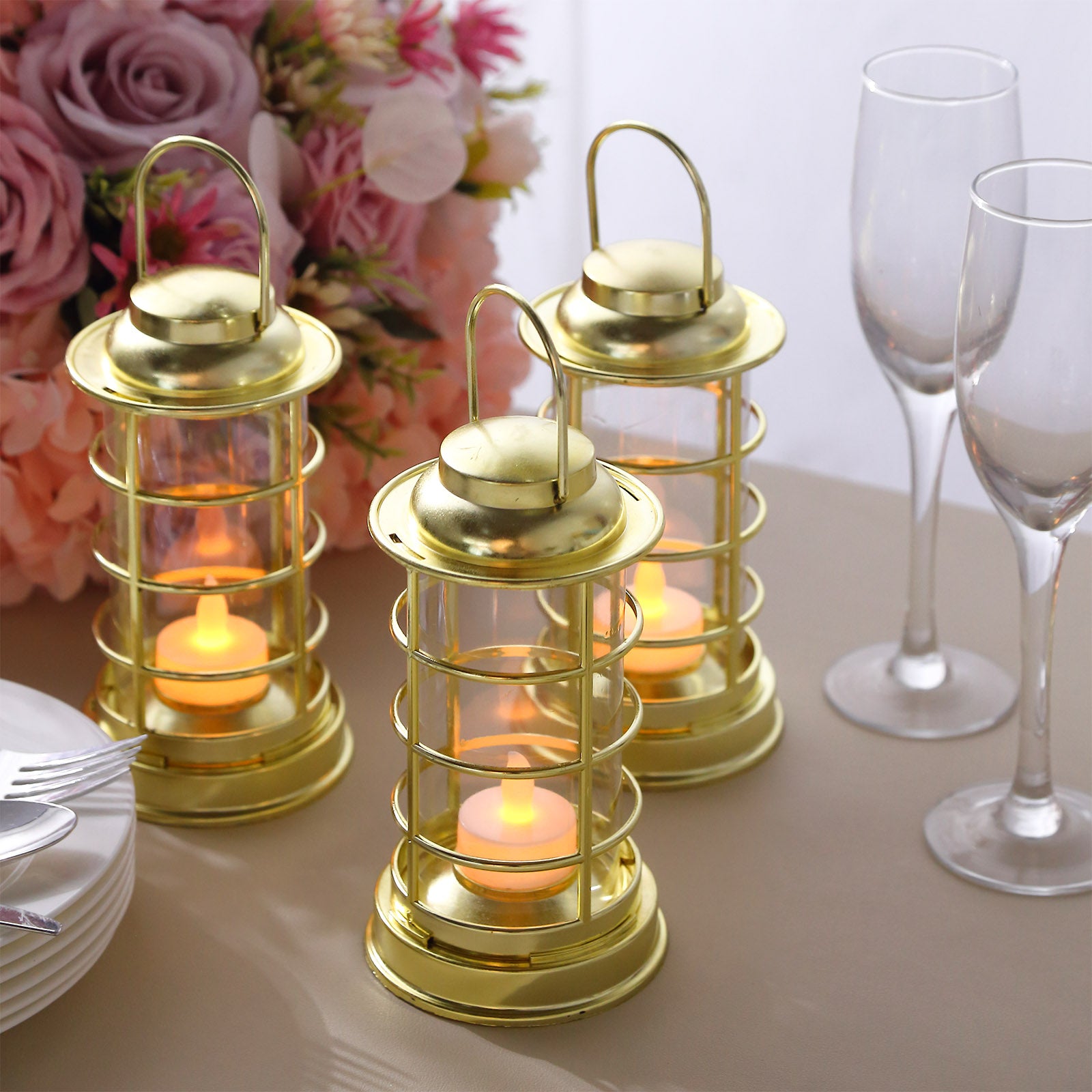 Gold LED mini lantern lamps with tealight candles for decorative use.